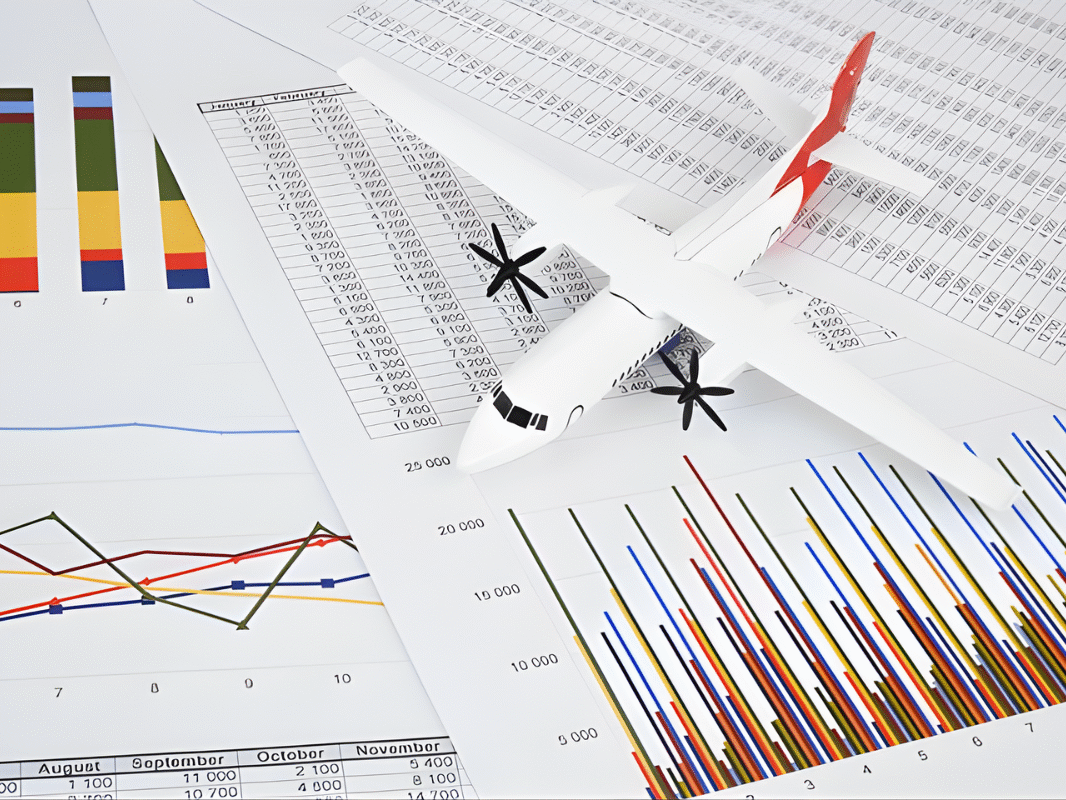 Aircraft over operational reports and performance charts, representing airline decision making under pressure during disruptions